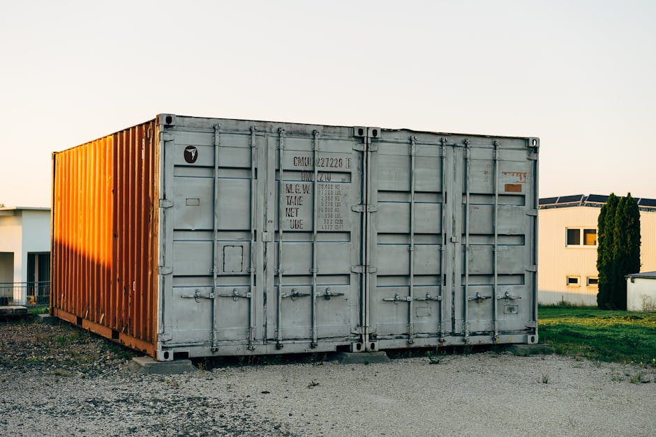 Outdoor view of a metal shipping container at a storage facility.